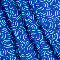 The Arcs - Blue - Women's Polo features an abstract blue fabric with wavy light blue lines and curves, soft shadows, and gentle folds. Its moisture-wicking design makes it ideal for active wear.