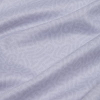 Close-up of the Stealth Mode - Light - Women's Polo's light gray fabric, showcasing a subtle wavy geometric pattern, soft texture, and moisture-wicking properties for lightweight comfort and a sense of depth.