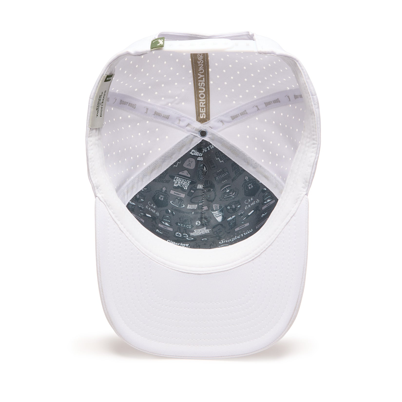 White baseball cap viewed from underneath, showing interior details including grey lining with assorted graphics and text, perforated inner fabric for breathability, and visible printed tags along the inner band. The brim is plain and curved.