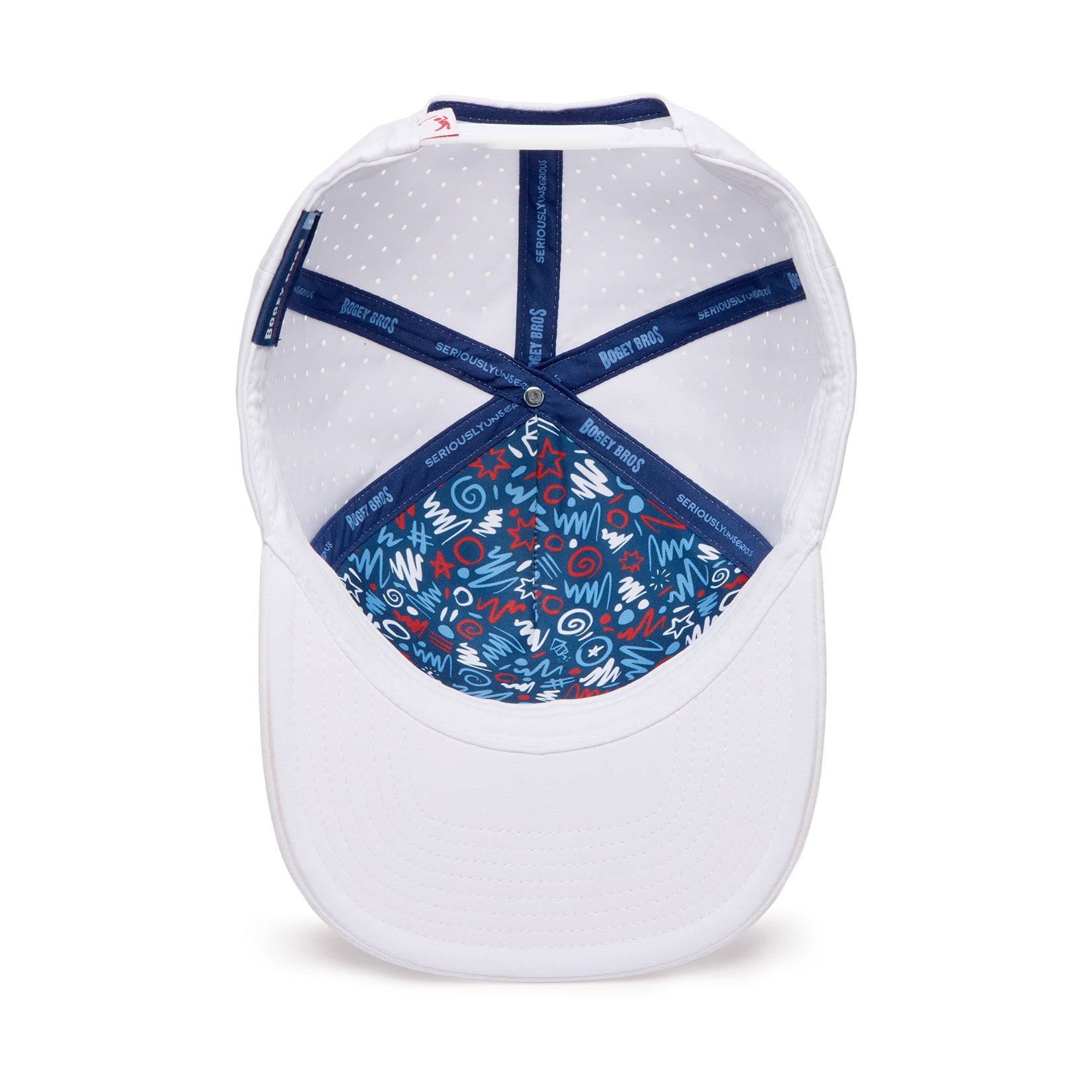 A white baseball cap viewed from underneath, showing a blue inner lining decorated with assorted colorful doodles and symbols. The hats seams are lined with navy blue bands featuring white text. The cap’s brim and exterior are solid white.