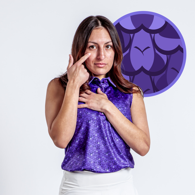 A woman wears the Eyes Up Here - People Eaters Women's Polo, a sleeveless purple athletic-fit top, touching her face and chest against a white background with a circular purple dragon scale pattern graphic.