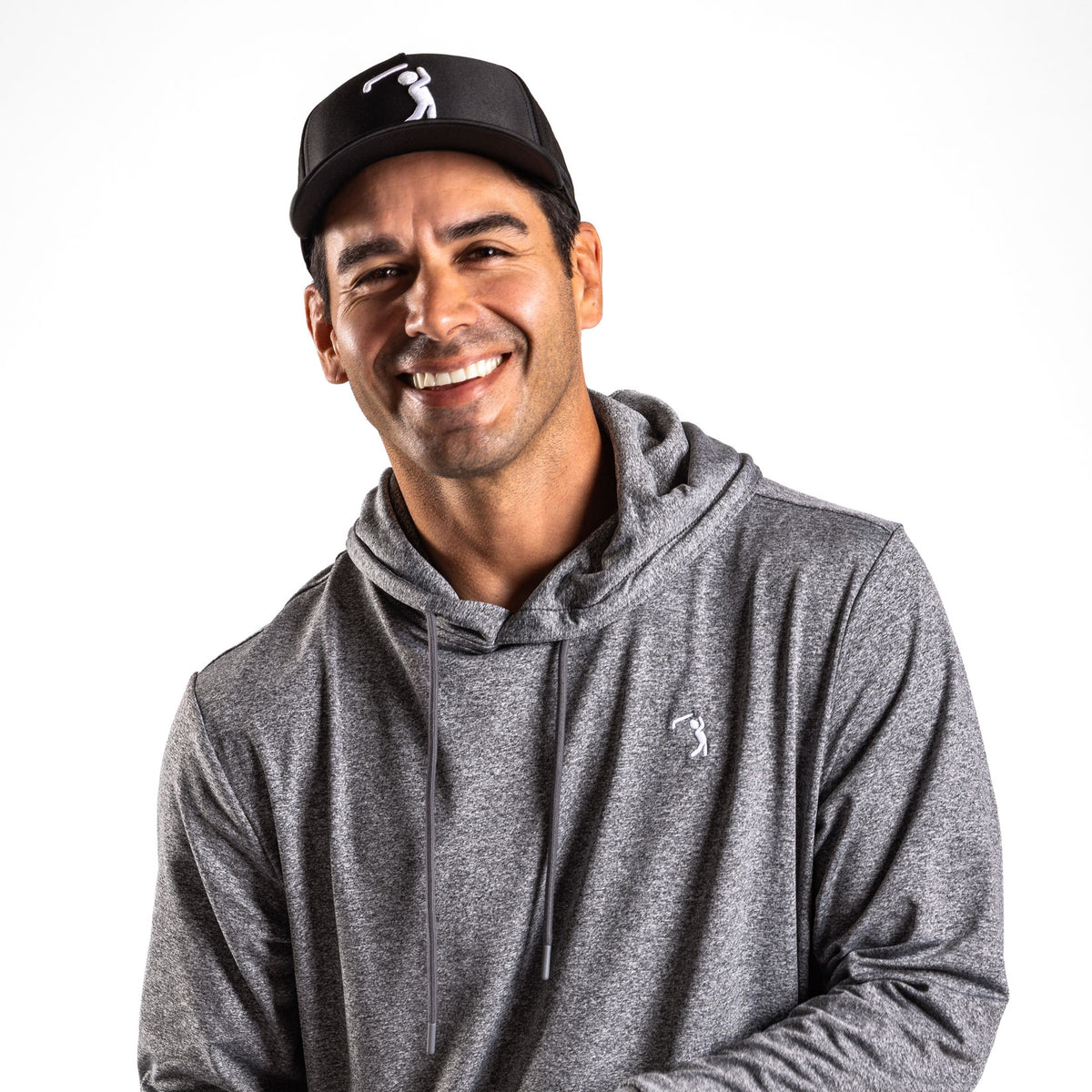 A man in the Heather Gray - Hoodie and a black baseball cap with a golfer logo smiles at the camera against a white background. His athletic fit hoodie, featuring a small golfer logo on the chest, provides moisture-wicking comfort for all-day wear. He has a short beard and stands with his arms relaxed.