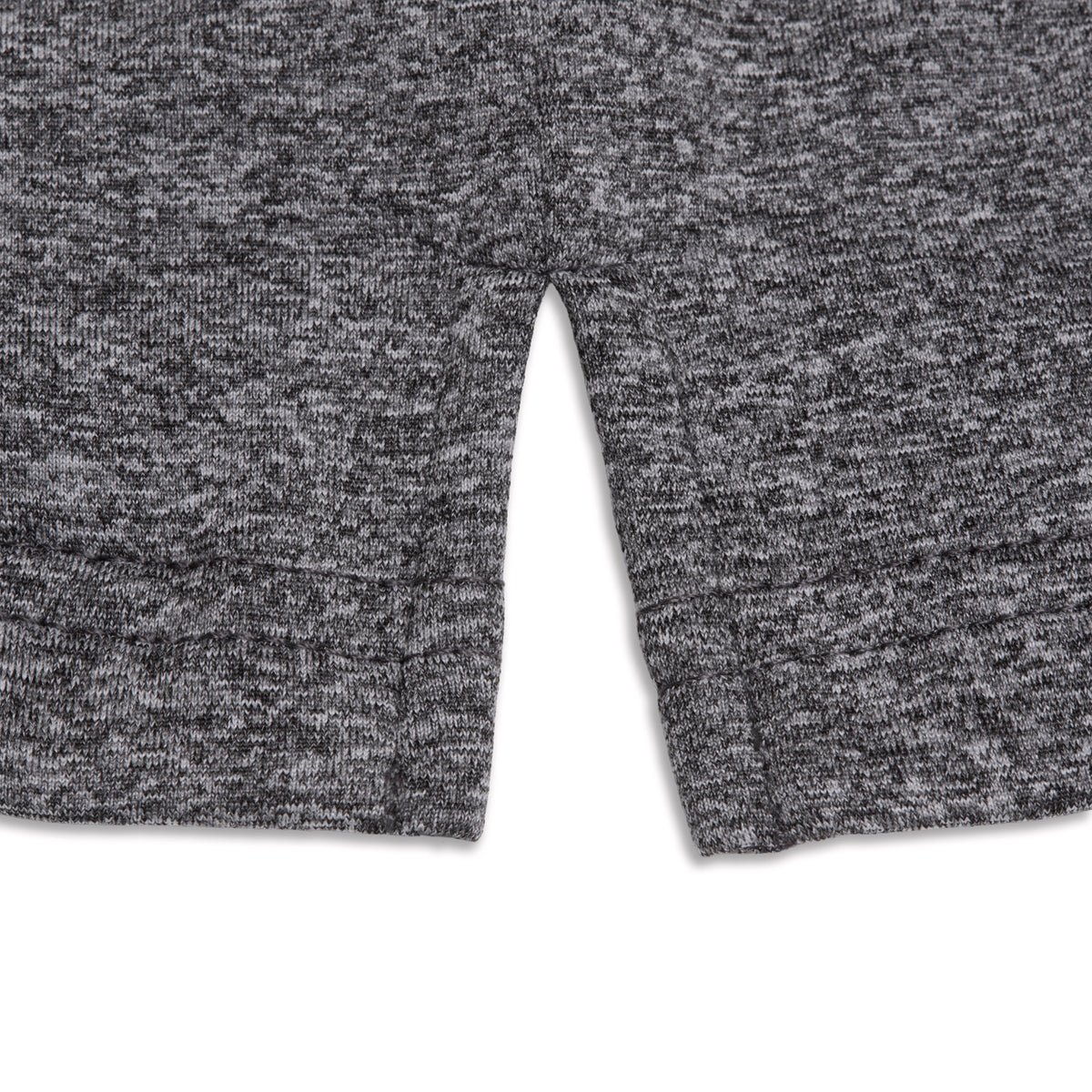 Close-up of the lower hem of the Heather Gray - Hoodie, showcasing its textured knit fabric in a soft, heathered gray. The material offers moisture-wicking properties to keep you comfortable, with neatly stitched edges and a plain white background accentuating the design.