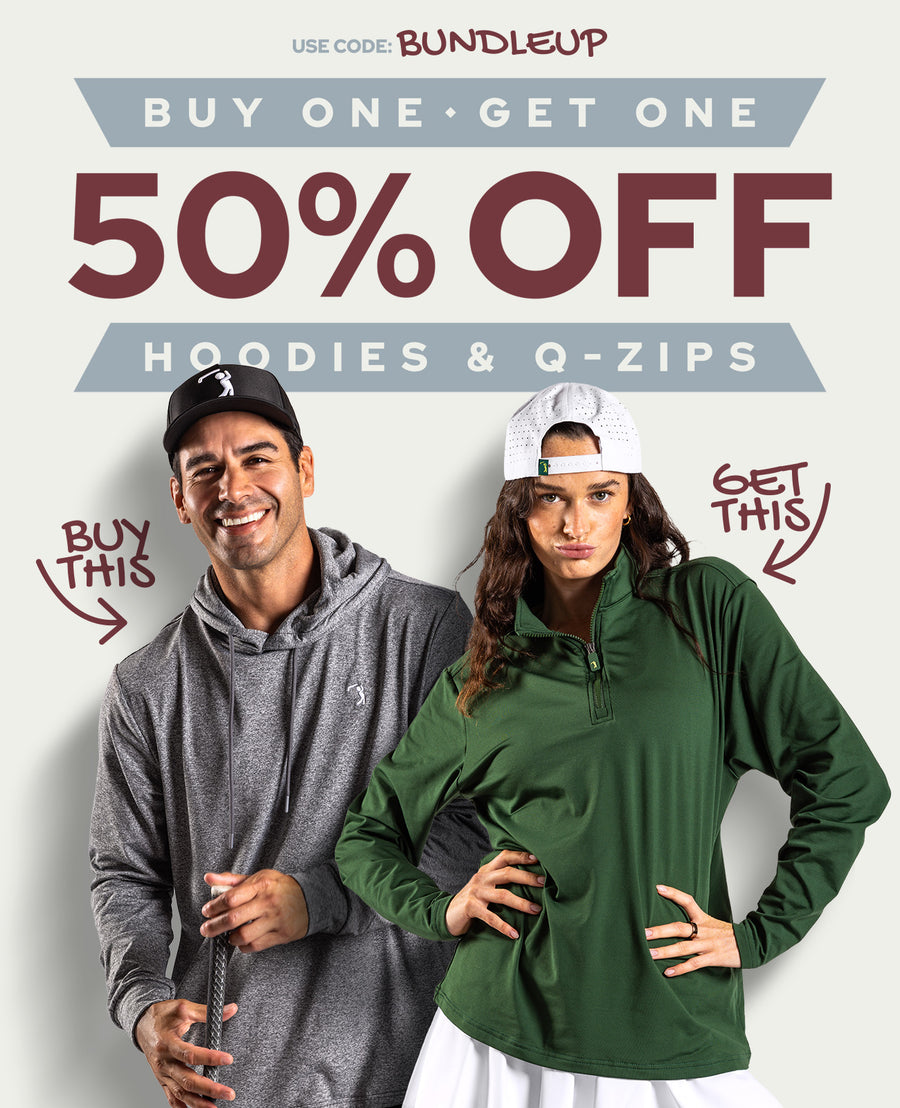 A smiling man in a gray hoodie and a serious woman in a green hoodie and white cap, both standing by bold text: Buy One Get One 50% Off Hoodies & Q-Zips. Arrows point to their clothing with Buy This and Get This. Promo code: BUNDLEUP.