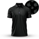 The Birdie Finger - Raven - Polo is a black polo shirt with an athletic fit, collar, and short sleeves, featuring a subtle gray pattern of hand icons making a middle finger gesture. Enlarged inset shows the repeating design detail.