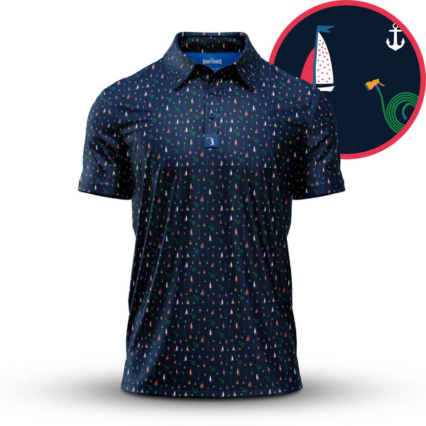The Boats and Hose - Polo is a navy athletic-fit collared shirt with small, colorful sailboat patterns and a circular graphic of a white sailboat, anchor, and green waves on a red/navy background. Features moisture-wicking fabric and blue label under the collar.