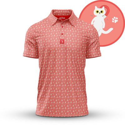 The "Kitty" Magnet - Polo is a pink, athletic-fit polo with moisture-wicking fabric and a subtle white cat pattern. Behind it: a red circle featuring an illustrated white cat, red heart, and small white paw print on a light background.