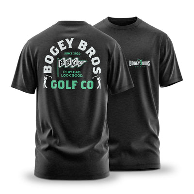 The Flagship - T-Shirt: Athletic black jersey tee with a stretchy, comfortable fit. Features "Bogey Bros Golf Co" in white and green plus a Play Bad, Look Good slogan with golf club graphics on the back; small front logo on left chest.