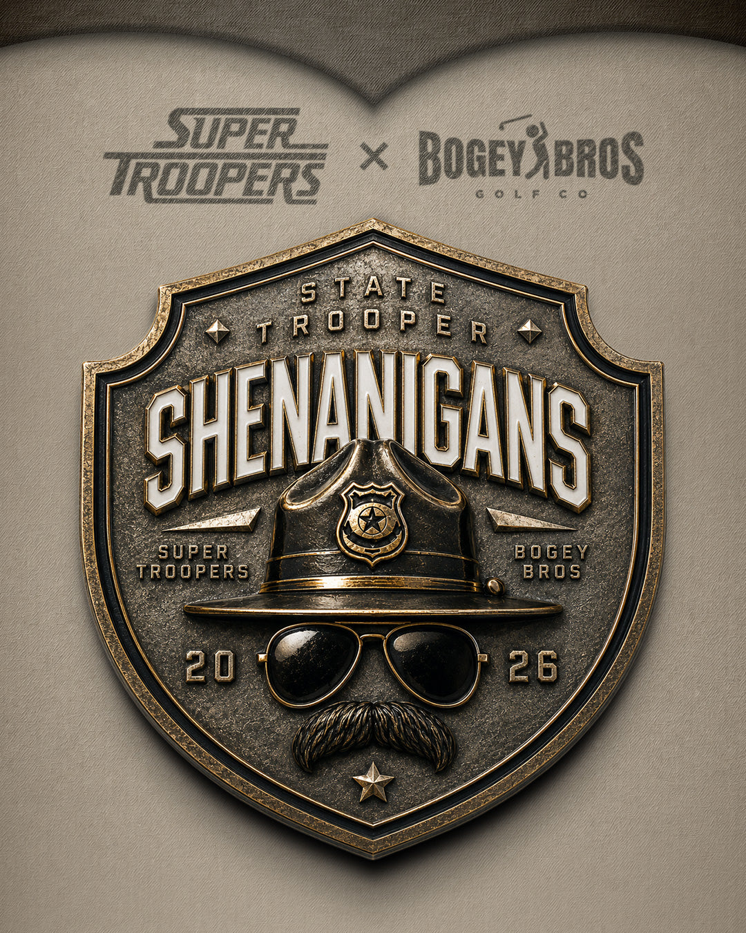 A metallic police badge reads STATE TROOPER SHENANIGANS with a cartoon hat, sunglasses, and mustache. Super Troopers and Bogey Bros are on the badge. Super Troopers x Bogey Bros Golf Co is above, with the year 2026 on the badge. Collection