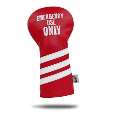 The EMERGENCY USE ONLY - Driver Headcover is red PU leather with three diagonal white stripes and bold embroidered "EMERGENCY USE ONLY" text. It stands upright, features a side tag, and casts a shadow on a white background.